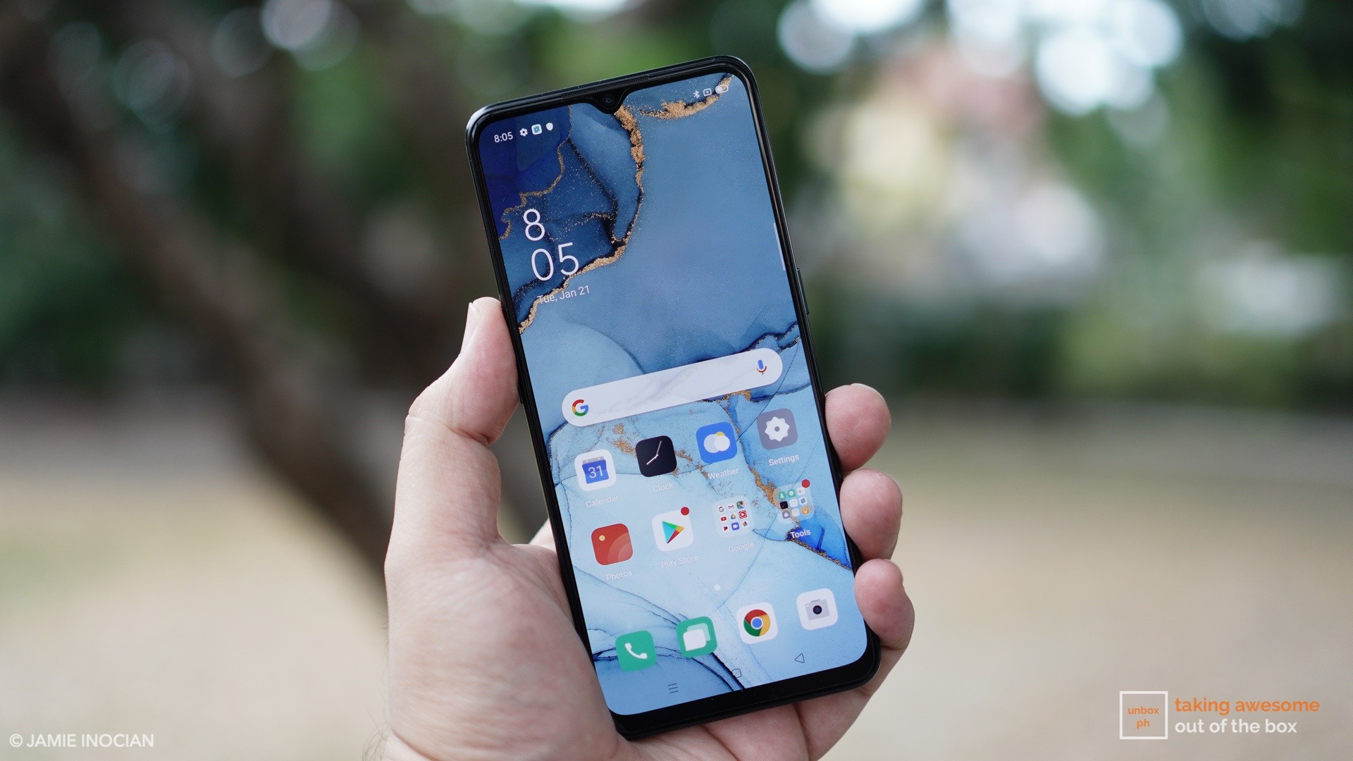 oppo reno3 pro in a hand