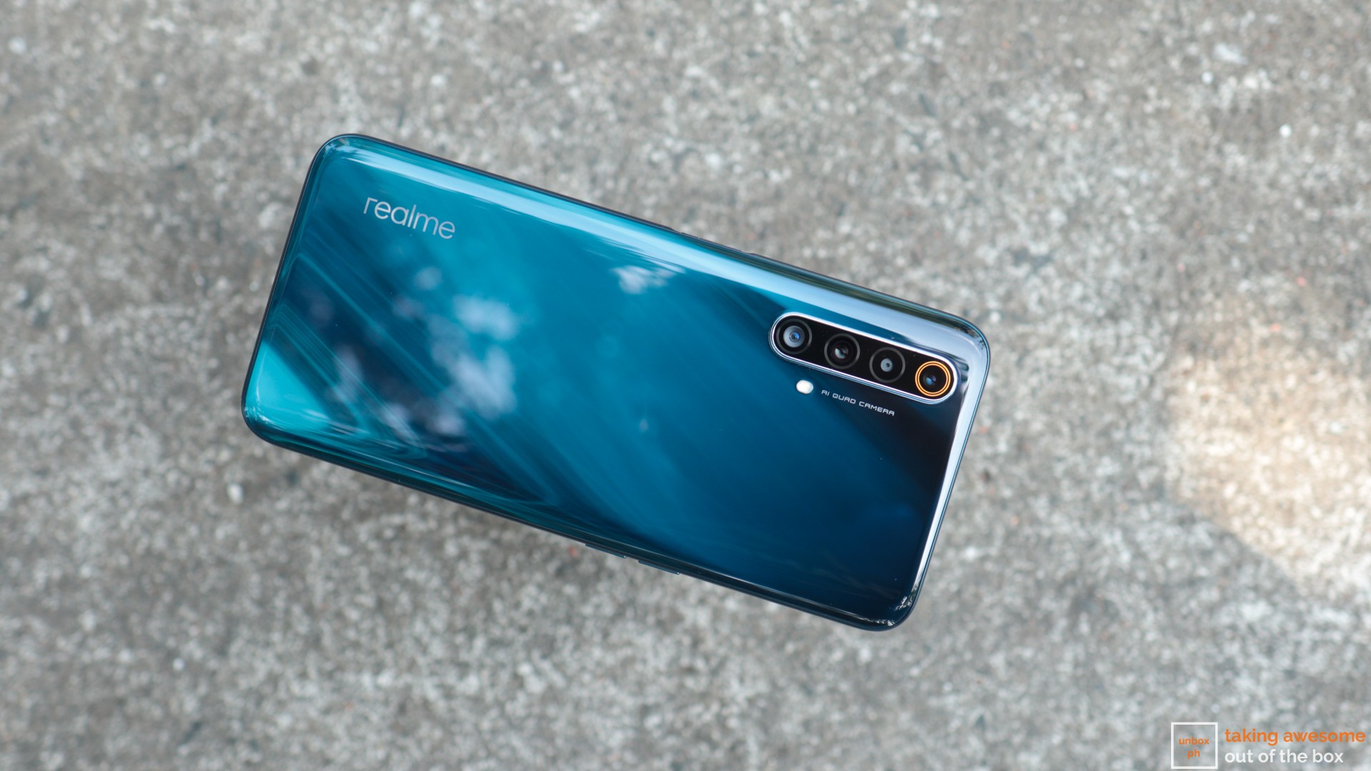 Realme X50 5G with a blue cover