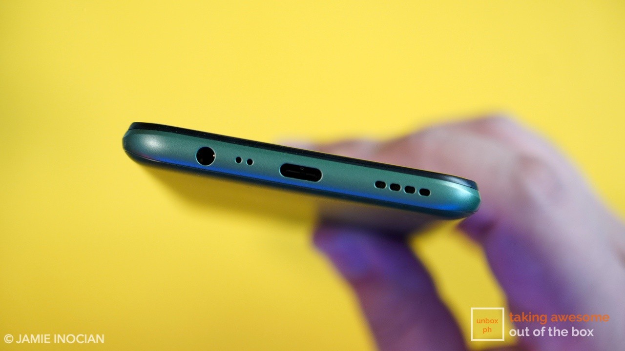 close up photo of the realme 6i charging port, audio jack, and speaker